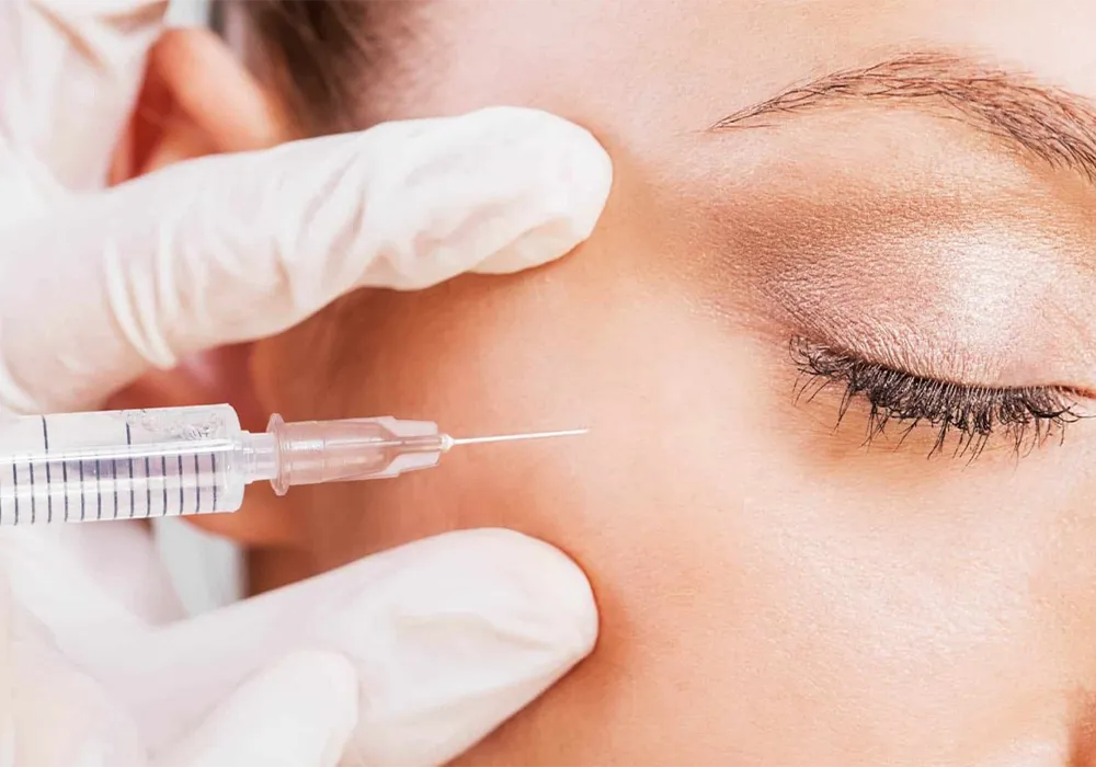 Removing dimples and dark circles under the eyes with filler injections